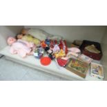 A mixed lot of 20thC juvenilia and collectables: to include composition and fabric dolls largest