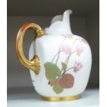An early 20thC Royal Worcester ivory glazed floral decorated and gilded china,