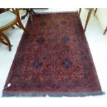 A Persian design rug decorated with stylised floral designs on a red ground 50'' x 74'' BSR