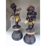 After Moreau - a pair of patinated bronze figures, standing on plinths 10.