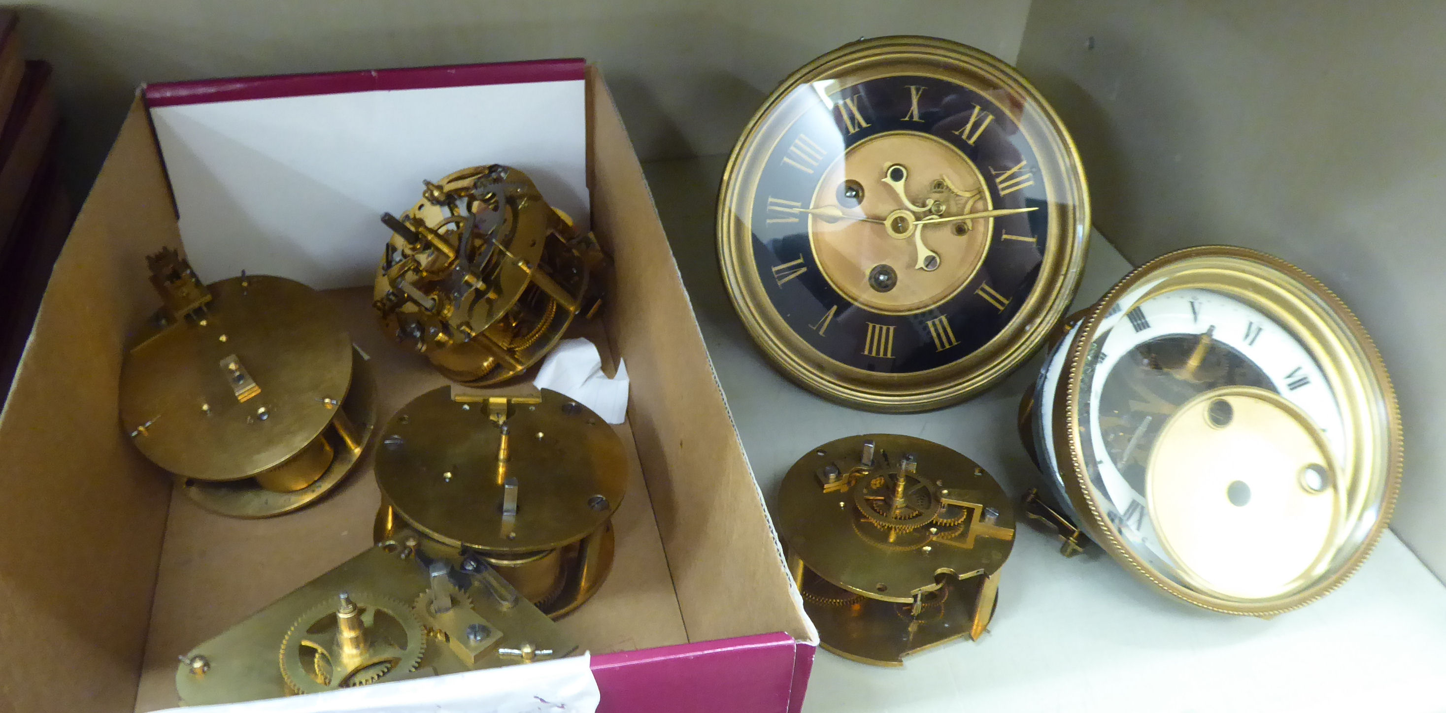 Seven late 19thC clock movements: to include an 8 day example with an enamel Roman dial OS5