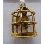 A 9ct gold bird cage design pendant 11