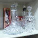 A mixed lot: to include four 20thC glass decanters,