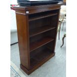 A late Victorian mahogany open front bookcase with three height adjustable shelves,