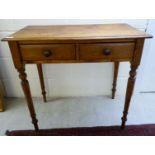 An early 20thC honey coloured rustic pine, two drawer side table,