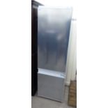 An (unused) Siemens integrated 60/40 fridge/freezer, in brushed stainless steel casing 70''h 21.