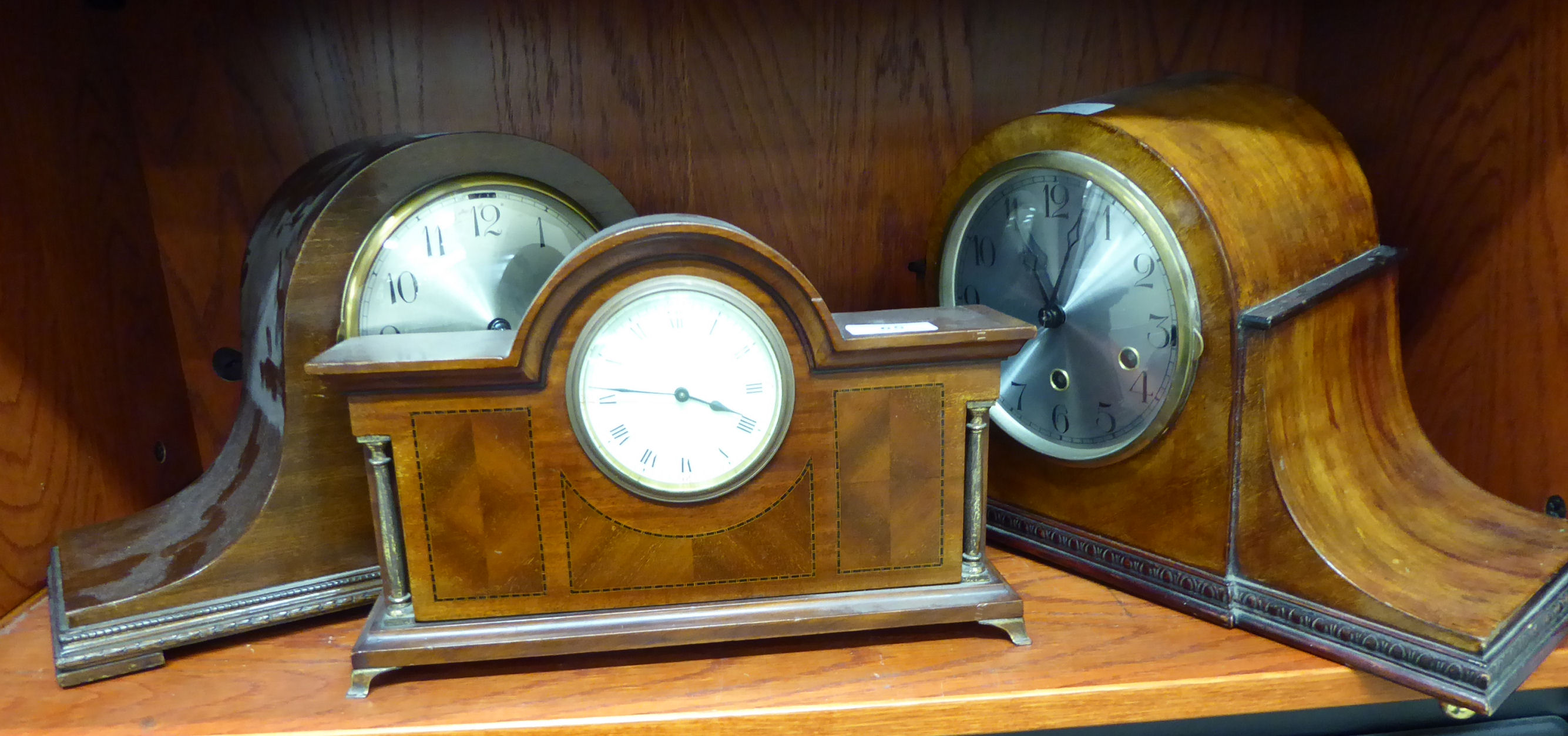 Three early 20thC mantle clocks: to include a mahogany cased example,