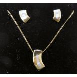 A 9ct gold diamond set pendant,