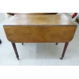 A late 19thC mahogany Pembroke table with an end drawer, raised on turned,