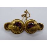 An 'antique' yellow metal and rhodolite garnet set bar brooch 11