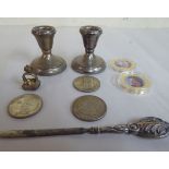 A mixed lot: to include a pair of loaded silver dwarf candlesticks marks rubbed 3''h OS10