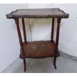 An early 20thC painted walnut two tier etagere with a low brass galleried bordered,