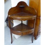 A late Victorian mahogany two tier corner washstand,