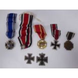 Three similar German military related Treue Fuhrer und Volk medals on ribbons, some copies, viz.