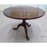 A George III mahogany tip-top pedestal table, on a turned column,