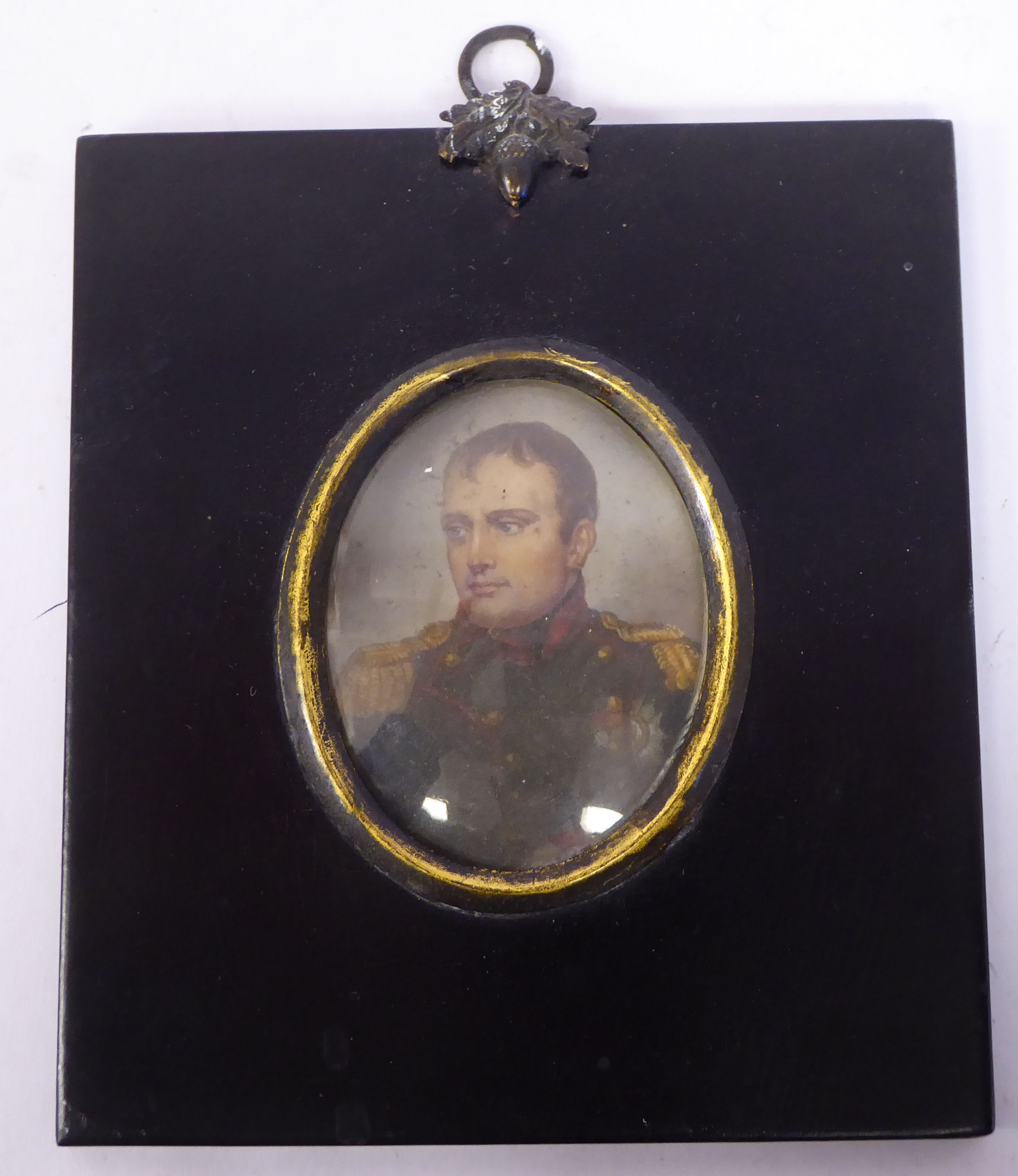 An early 19thC oval head and shoulders portrait miniature,