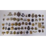 Approx fifty military cap badges and other insignia, some copies: to include Army Cyclist Corps,