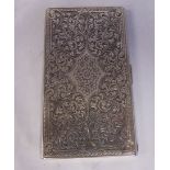 An Italian silver coloured metal folding cigarette case with bright cut floral and foliate scrolled