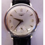 A Longines stainless steel cased wristwatch, faced by an Arabic and baton dial,