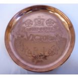 A Queen Victoria commemorative copper shallow dish with a rolled rim,