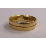 A 14ct gold milled band ring