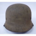 A World War II German Luftwaffe double decal steel helmet (Please Note: this lot is offered