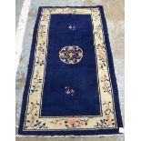 A Chinese woollen rug, circa 1950s, decorated in traditional taste,