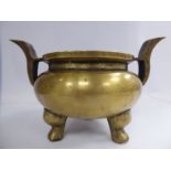 A 19th/20thC Chinese cast bronze censer of squat, bulbous form with opposing tab handles,