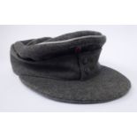 A German army Officers ski cap with silver braided piping, a woven,