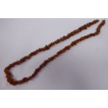 A randomly rough-cut amber coloured bead necklace