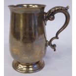 A silver tankard of slender baluster form with a hollow, double C-scrolled acanthus top handle,