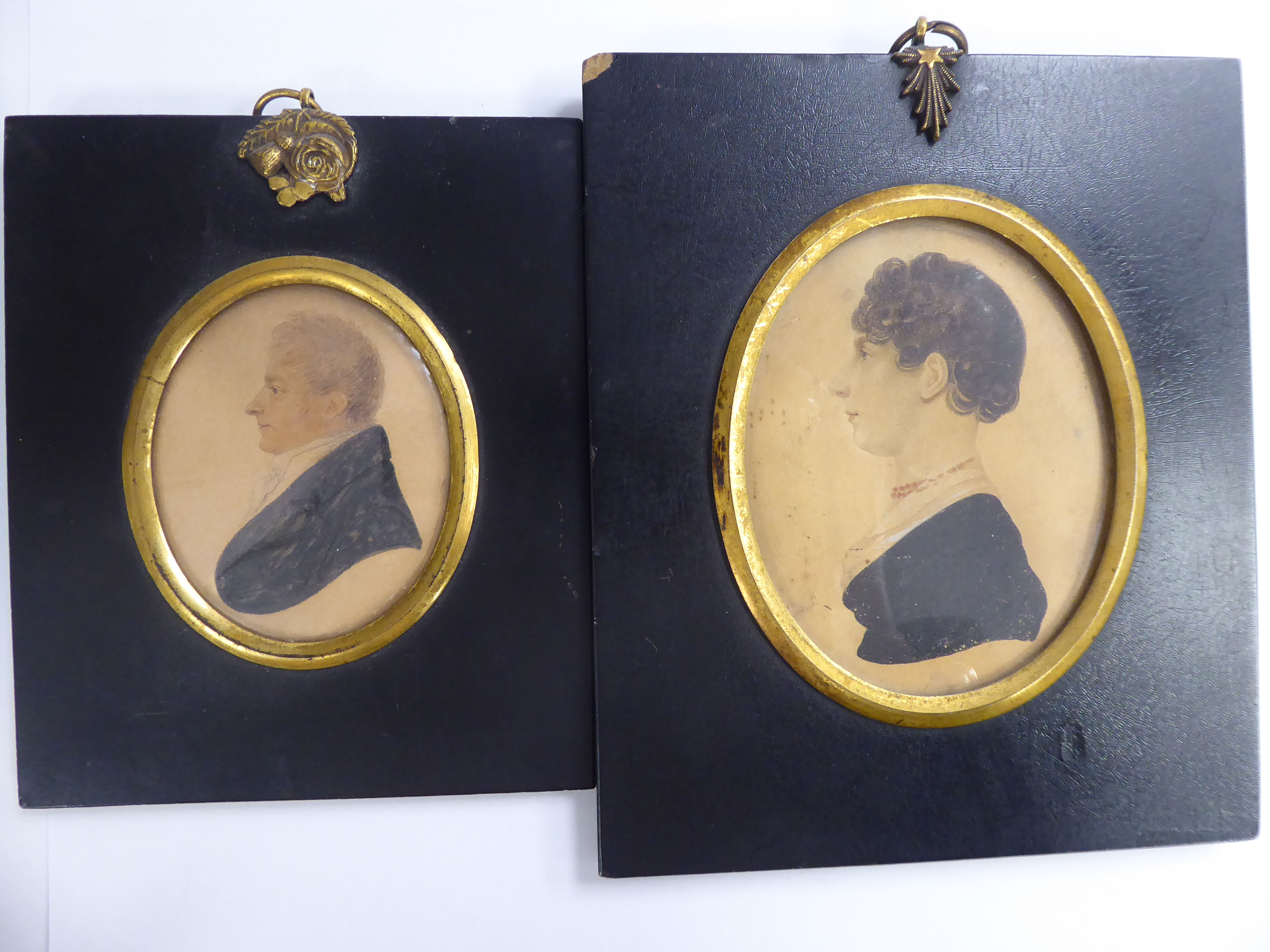 Two similar mid 19thC oval head and shoulders profile portrait miniatures,