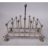 A late Victorian Christopher Dresser inspired silver plated rod and ball framed,