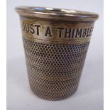 A silver novelty tumbler cup of thimble design,