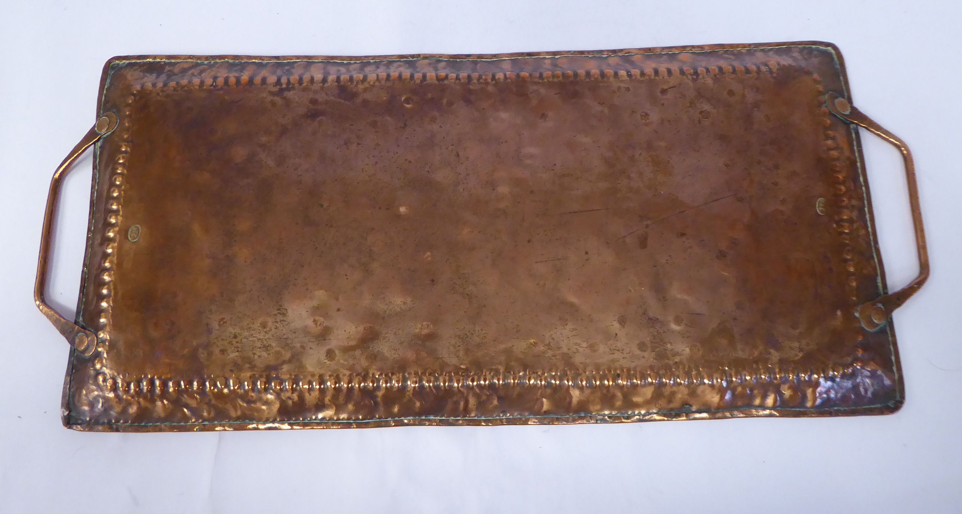 An Arts & Crafts twin handled copper tray with spot-hammered decoration to the border bearing the - Image 3 of 4