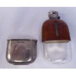 A late Victorian clear glass, silver mounted and part snakeskin clad hip flask with a rotating,