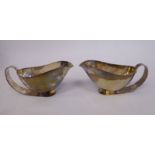 A pair of EPNS Art Deco sauce boats, the bowls on stylised,