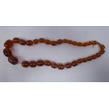 A graduated amber coloured bead necklace