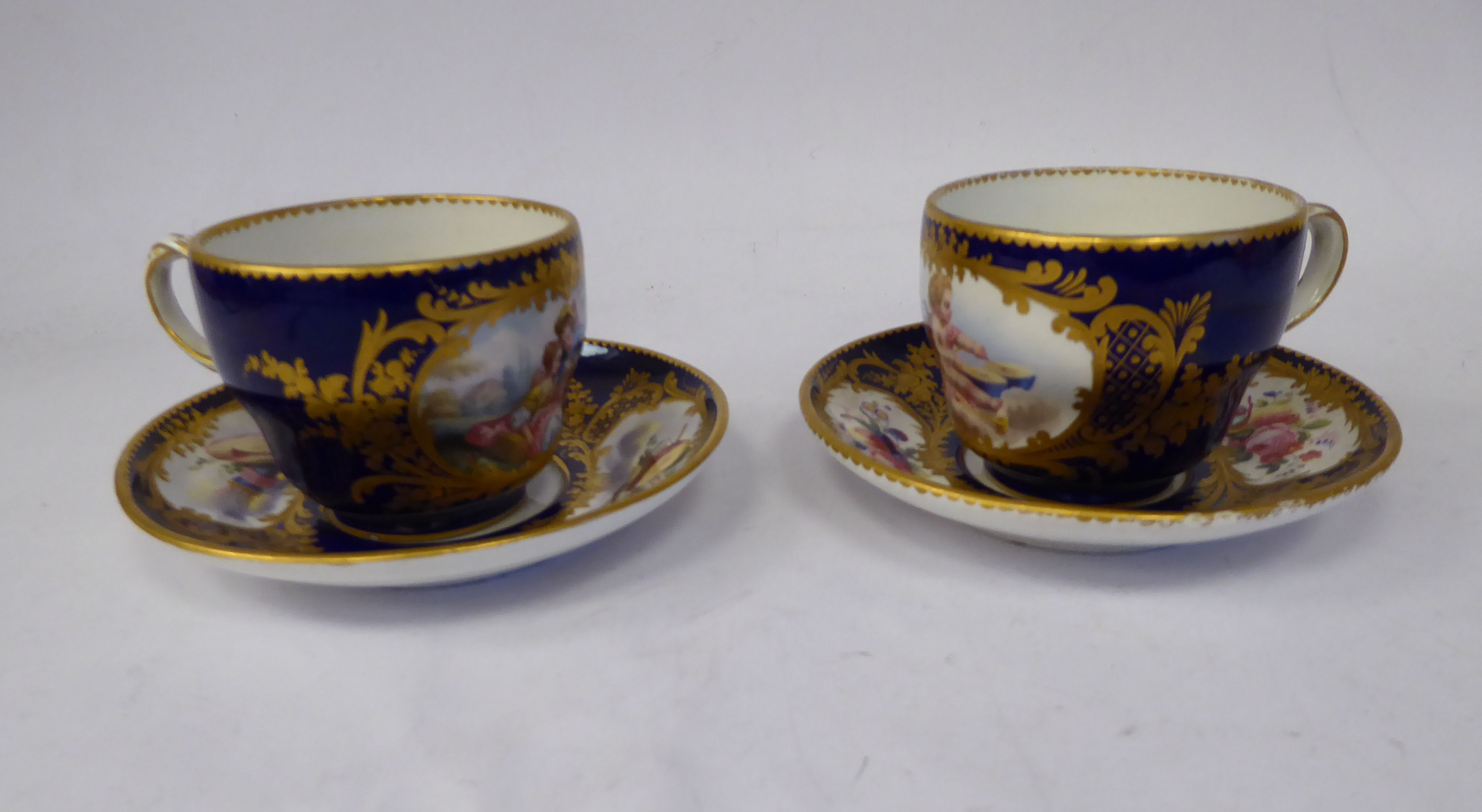 A late 19thC Continental porcelain, ogee shaped tea cup and saucer,
