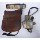 A 1950s London Transport bus conductor's stitched and rivetted brown hide money satchel with two