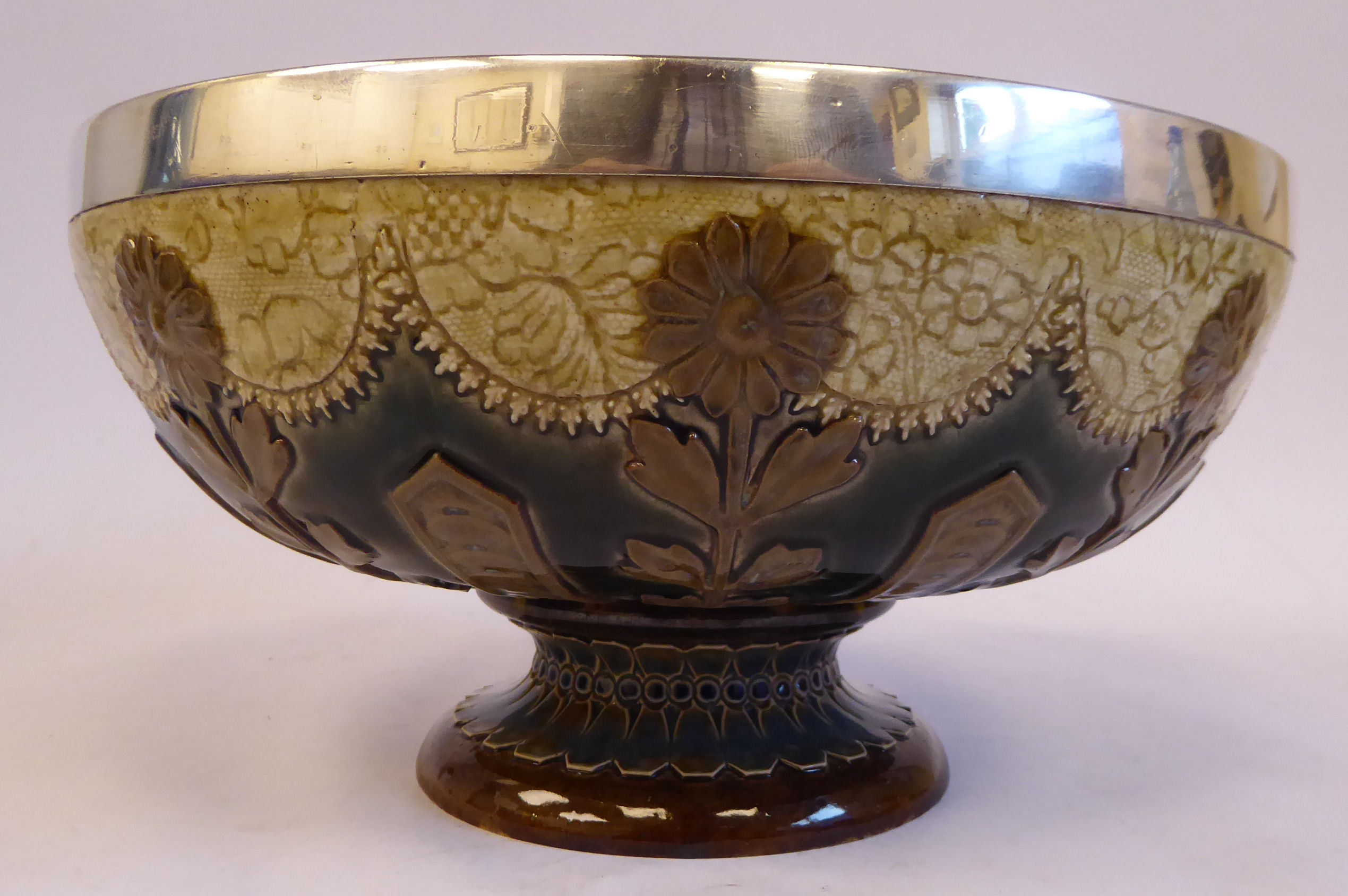 A Doulton Lambeth brown, cream coloured and green glazed stoneware, shallow, pedestal fruit bowl,