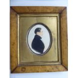 An early 19thC oval, head and shoulders profile portrait miniature,