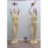 A pair of mid 20thC painted plaster figural lamp standards,