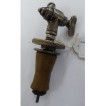 A mid Victorian Farrow & Jackson steel wine tap with an angled spout and an expandable collar