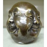 A cast metal four sided Buddha head 3.