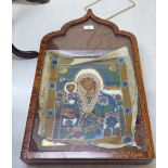 A painted and gilded Russian icon with an overlaid needlepoint and beadwork panel,