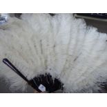 An Ostrich feather fan with simulated tortoiseshell sticks and guards 17''L,