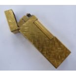 A gold plated Dunhill cigarette lighter with engine turned decoration 11