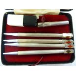 A set of four silver bridge pencils,