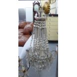 A mid 20thC gilt metal three tier bag design centre light fitting with multiple cut glass drops